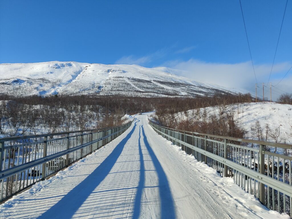 Snowy road on a bridge in Abisko